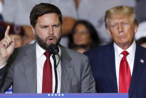 FILE - Republican Ohio Senate candidate JD Vance speaks as Republican presidential candidate former President Donald Trump listens at a campaign rally in Youngstown, Ohio., Sept. 17, 2022.  Trump says Vance will be his vice presidential pick for 2024. He says on his Truth Social Network that, “After lengthy deliberation and thought, and considering the tremendous talents of many others, I have decided that the person best suited to assume the position of Vice President of the United States is Senator J.D. Vance of the Great State of Ohio.” (AP Photo/Tom E.