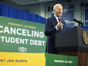 FILE - President Joe Biden speaks about student loan debt, April 8, 2024, in Madison, Wis. A federal appeals court has blocked the implementation of the Biden administration's student debt relief plan, which would have lowered monthly payments for millions of borrowers. In a ruling Thursday, July 18, the 8th Circuit Court of Appeals granted a request by a group of Republican-led states seeking to invalidate the administration's entire loan forgiveness program.