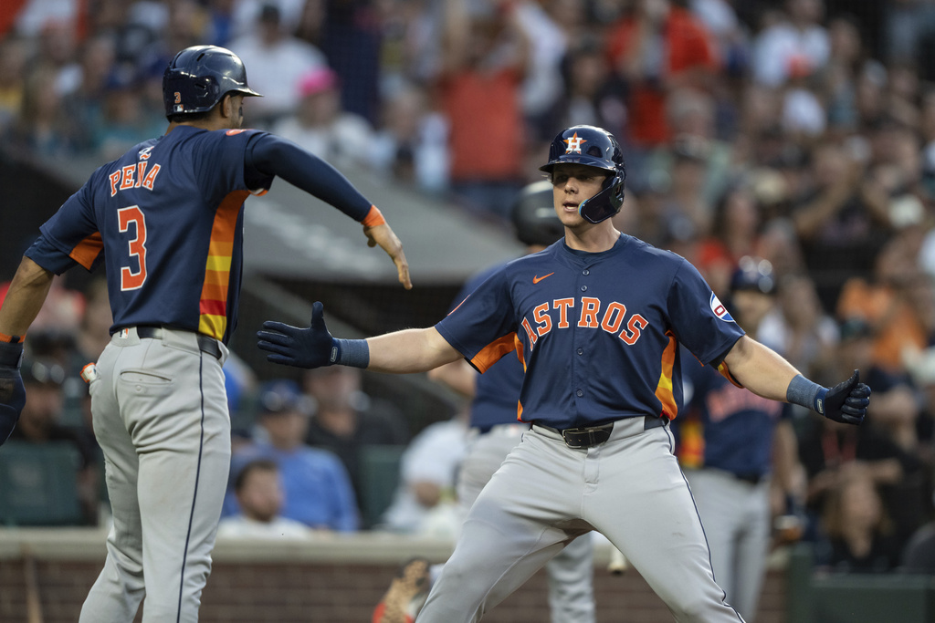 Houston Astros' Jake Meyers, right, celebrates with Jeremy Pena after hitting a two-run home run during the seventh inning of a baseball game against the Seattle Mariners, Saturday, July 20, 2024, in Seattle.