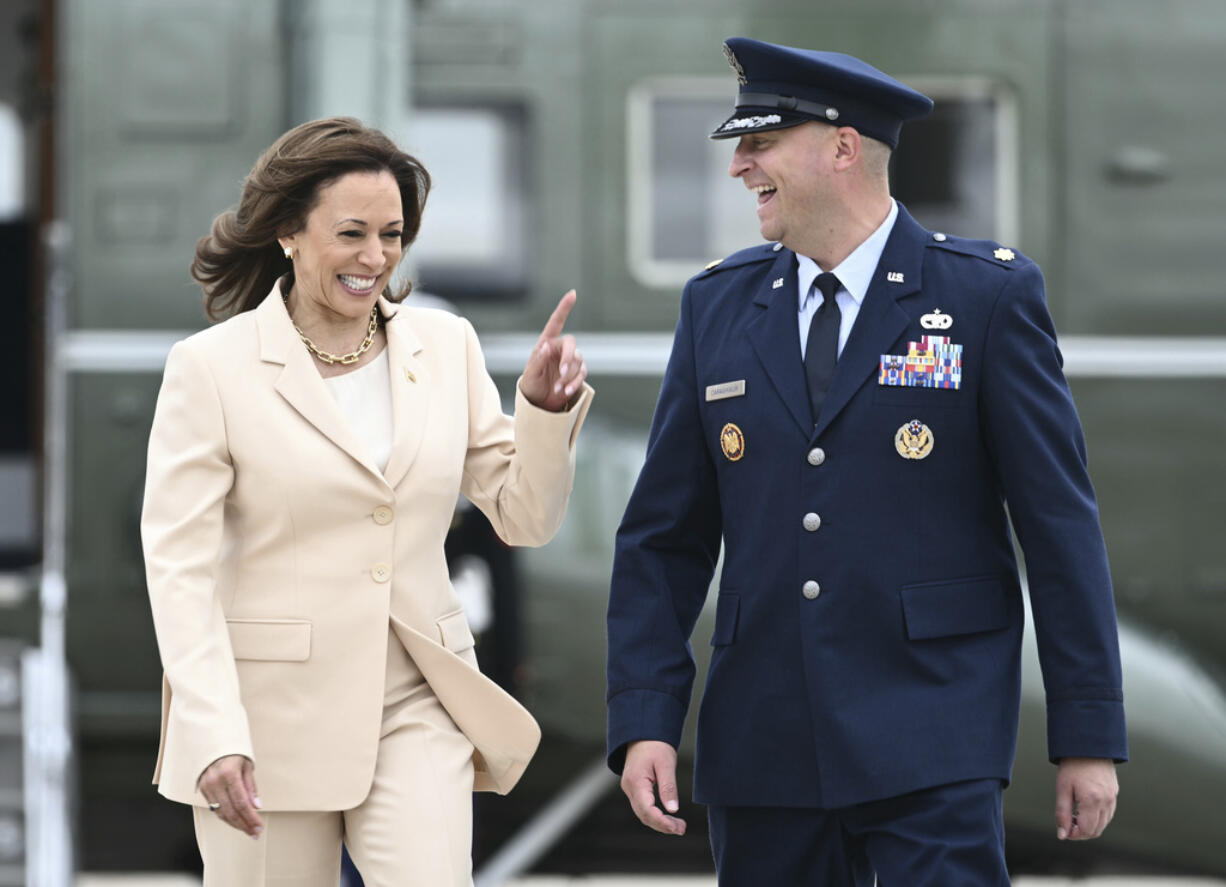 Vice President Kamala Harris arrives to board Air Force Two at Andrews Air Force Base, Md., Wednesday, July 24, 2024 and is escorted by U.S. Air Force, Director of Flightline Protocol, Maj. Philippe Caraghiaur. Harris is traveling to Indianapolis to deliver the keynote speech at Zeta Phi Beta Sorority, Inc.'s Grand Boul' event.