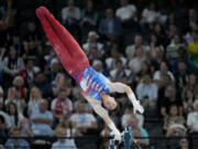 Brody Malone, of United States, competes on the horizontal bar during a men's artistic gymnastics qualification round at the 2024 Summer Olympics, Saturday, July 27, 2024, in Paris, France.