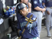 Seattle Mariners' Jorge Polanco celebrates his home run off Chicago White Sox starting pitcher Erick Fedde, with the team's trident during the fourth inning of a baseball game Saturday, July 27, 2024, in Chicago.