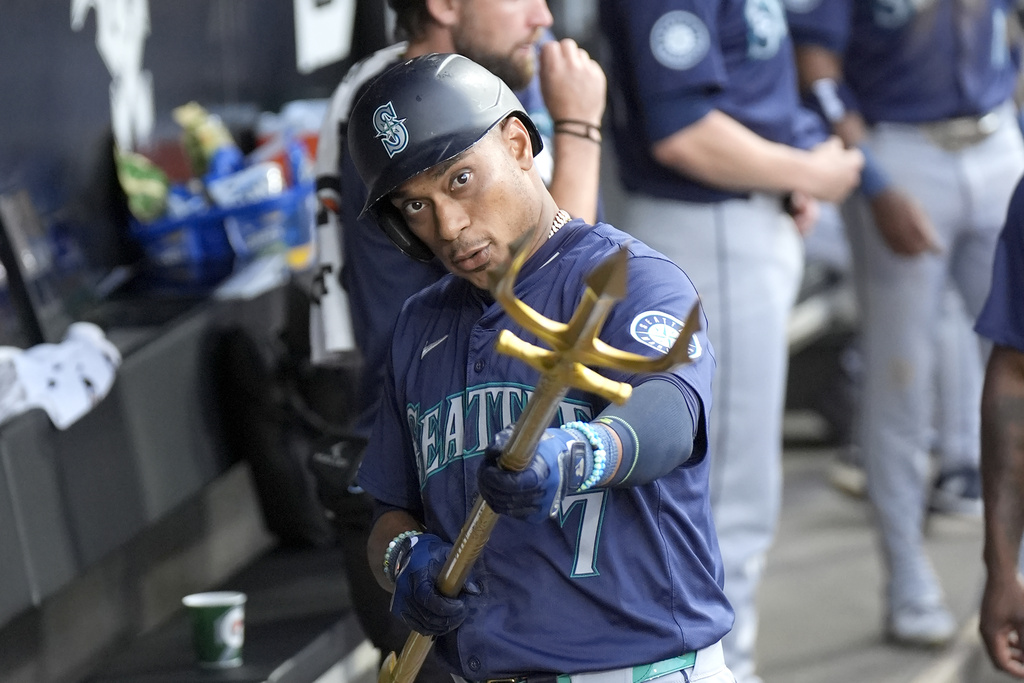 Seattle Mariners' Jorge Polanco celebrates his home run off Chicago White Sox starting pitcher Erick Fedde, with the team's trident during the fourth inning of a baseball game Saturday, July 27, 2024, in Chicago.