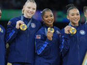 From left to right, Simone Biles, Oregon State's Jade Carey, Prairie High School grad Jordan Chiles, Suni Lee and Hezly Rivera celebrates after winning the gold medal during the women's artistic gymnastics team finals round at Bercy Arena at the 2024 Summer Olympics, Tuesday, July 30, 2024, in Paris, France.