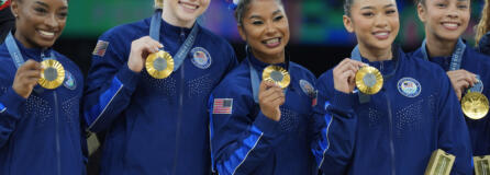 From left to right, Simone Biles, Oregon State's Jade Carey, Prairie High School grad Jordan Chiles, Suni Lee and Hezly Rivera celebrates after winning the gold medal during the women's artistic gymnastics team finals round at Bercy Arena at the 2024 Summer Olympics, Tuesday, July 30, 2024, in Paris, France.