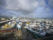 Fishing vessels lie damaged after Hurricane Beryl passed through the Bridgetown Fisheries in Barbados, Monday, July 1, 2024.