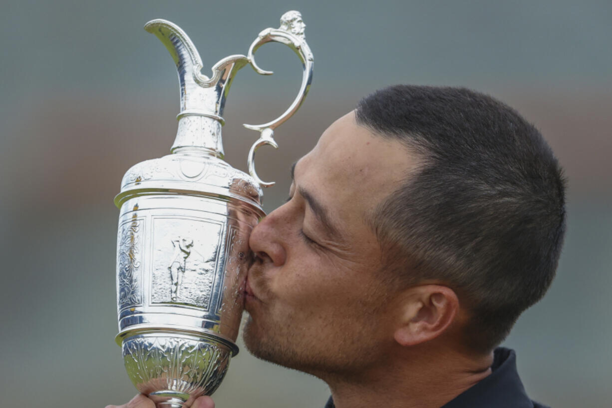 Xander Schauffele of the United States kisses the Claret Jug trophy after winning the British Open Golf Championships at Royal Troon golf club in Troon, Scotland, Sunday, July 21, 2024.