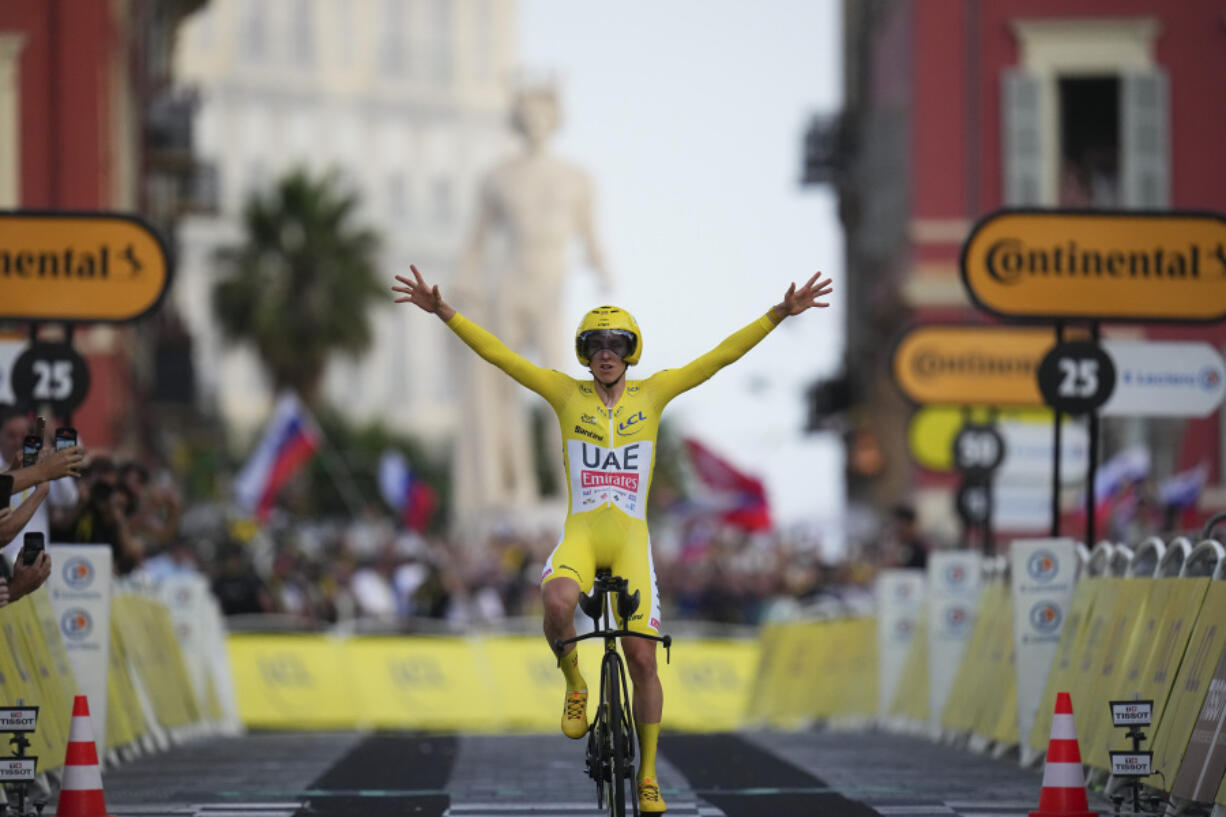 Tour de France winner Slovenia&rsquo;s Tadej Pogacar celebrates as he crosses the finish line of the 21st stage of the Tour de France cycling race, an individual time trial  on Sunday.