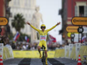 Tour de France winner Slovenia&rsquo;s Tadej Pogacar celebrates as he crosses the finish line of the 21st stage of the Tour de France cycling race, an individual time trial  on Sunday.