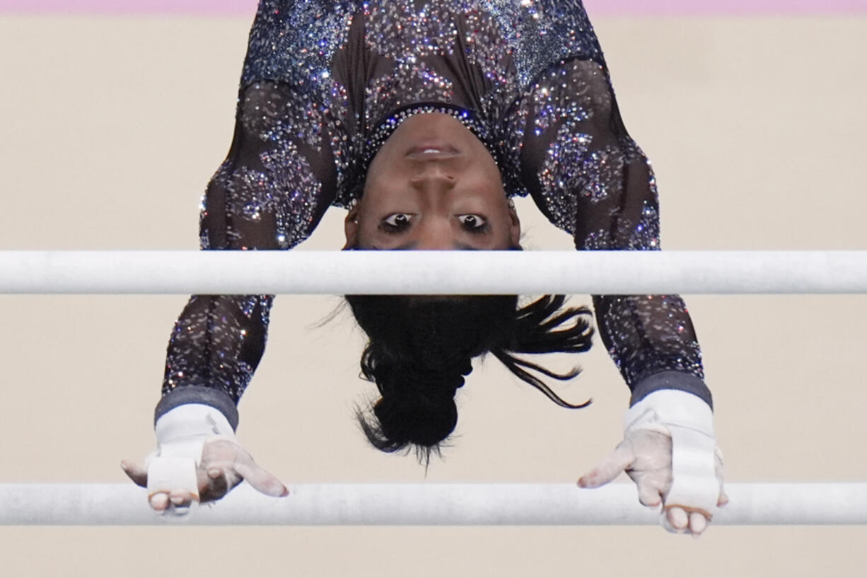 Simone Biles, of United States, competes on the uneven bars during a women&#039;s artistic gymnastics qualification round at Bercy Arena at the 2024 Summer Olympics, Sunday, July 28, 2024, in Paris, France.