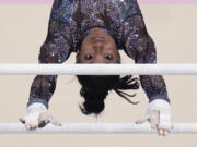 Simone Biles, of United States, competes on the uneven bars during a women&#039;s artistic gymnastics qualification round at Bercy Arena at the 2024 Summer Olympics, Sunday, July 28, 2024, in Paris, France.