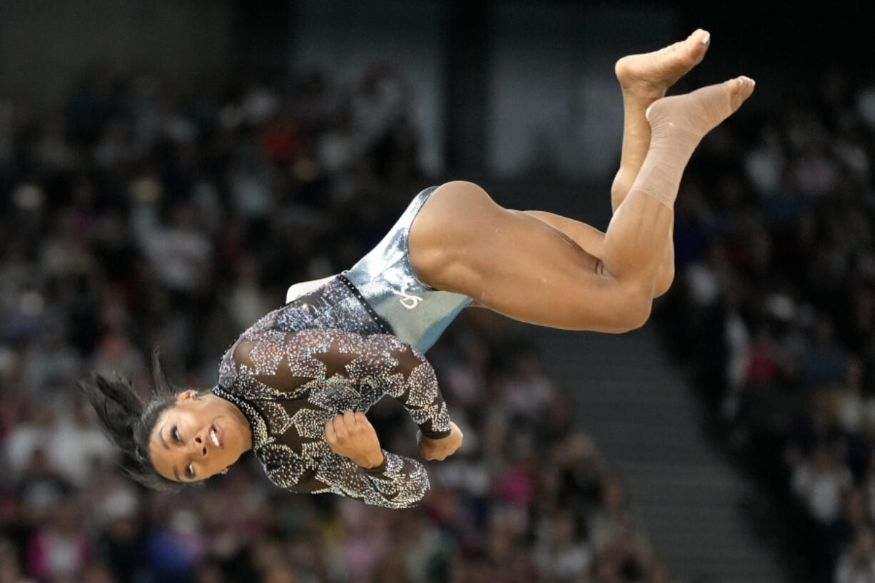 Simone Biles, of United States, competes on the floor exercise during a women&#039;s artistic gymnastics qualification round at Bercy Arena at the 2024 Summer Olympics, Sunday, July 28, 2024, in Paris, France.