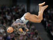 Simone Biles, of United States, competes on the floor exercise during a women&#039;s artistic gymnastics qualification round at Bercy Arena at the 2024 Summer Olympics, Sunday, July 28, 2024, in Paris, France.