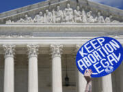 FILE - A person holds up a sign as abortion-rights activists and Women&rsquo;s March leaders protest as part of a national day of strike actions outside the Supreme Court, Monday, June 24, 2024, in Washington. A growing number of women said they&rsquo;ve tried to end their pregnancies on their own by doing things like taking herbs, drinking alcohol or even hitting themselves in the belly, a new study suggests. Researchers surveyed reproductive-age women in the U.S. before and after the Supreme Court overturned Roe v. Wade in June 2022.