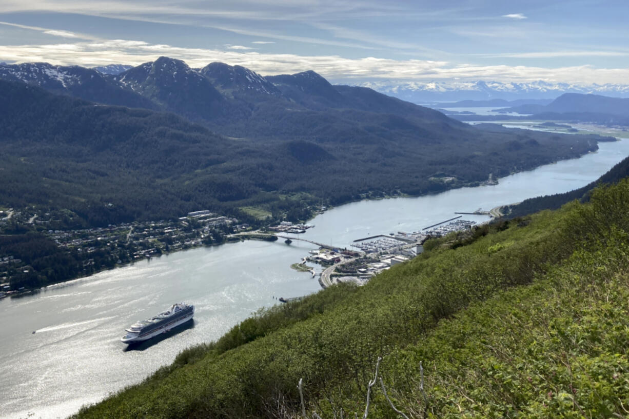 FILE - A cruise ship departs from downtown Juneau, on June 7, 2023, along the Gastineau Channel, in Alaska. Voters in Alaska&rsquo;s capital city could decide in October whether to ban large cruise ships on Saturdays starting next year.