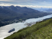 FILE - A cruise ship departs from downtown Juneau, on June 7, 2023, along the Gastineau Channel, in Alaska. Voters in Alaska&rsquo;s capital city could decide in October whether to ban large cruise ships on Saturdays starting next year.