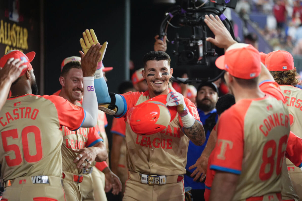 American League&rsquo;s Jarren Duran, of the Boston Red Sox, celebrates hi two-run home run with teammates in the dugout in the fifth inning during the MLB All-Star baseball game, Tuesday, July 16, 2024, in Arlington, Texas.