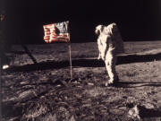 FILE - In this photo provided by NASA, astronaut Edwin &ldquo;Buzz&rdquo; Aldrin poses for a photograph beside the U.S. flag deployed on the moon during the Apollo 11 mission on July 20, 1969.