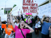 FILE - Protesters join thousands marching around the Arizona Capitol in Phoenix, protesting the U.S. Supreme Court&rsquo;s decision to overturn Roe v. Wade, June 24, 2022. Abortion rights advocates are set to deliver about 800,000 petition signatures Wednesday, July 3, 2024, in hopes of getting abortion rights on the November general election ballot. (AP Photo/Ross D.