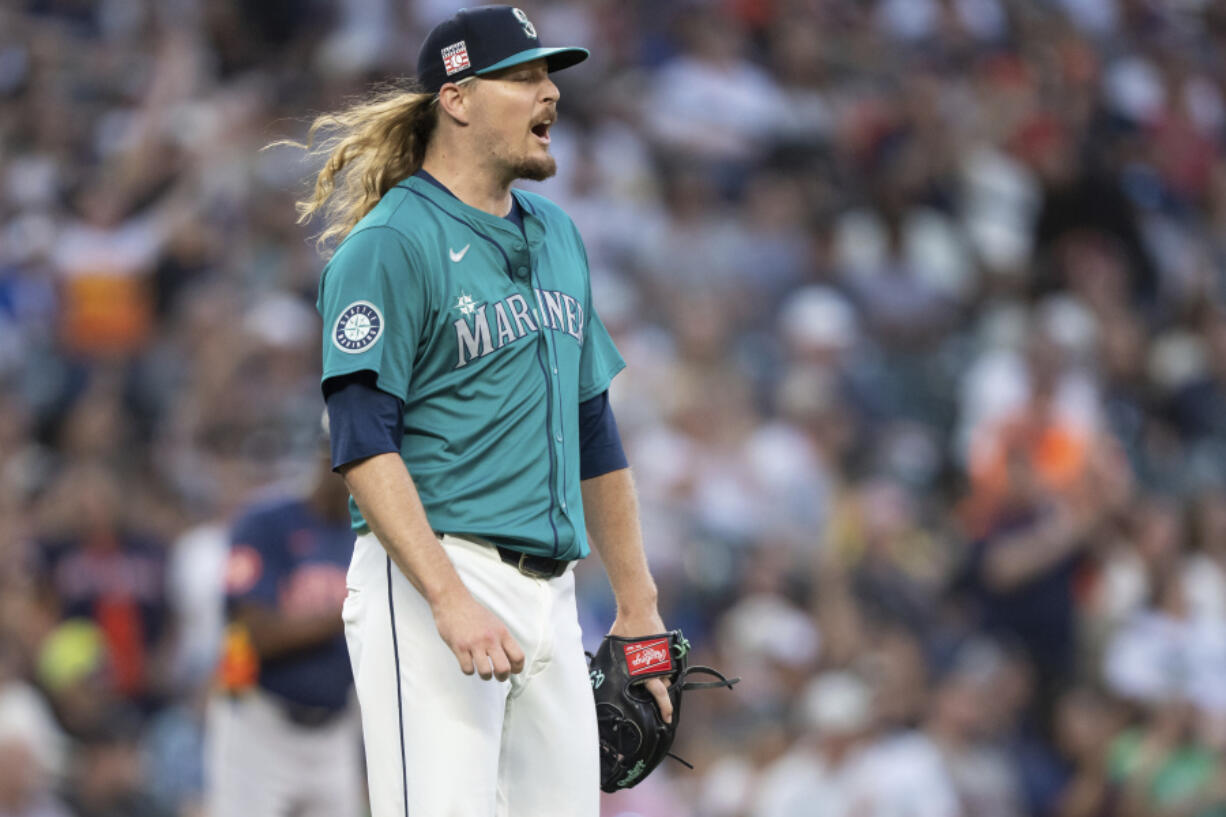 Seattle Mariners relief pitcher Ryne Stanek reacts after giving up a two-run home run during the seventh inning of a baseball game against the Houston Astros, Saturday, July 20, 2024, in Seattle.