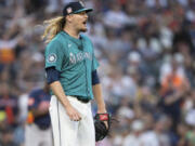 Seattle Mariners relief pitcher Ryne Stanek reacts after giving up a two-run home run during the seventh inning of a baseball game against the Houston Astros, Saturday, July 20, 2024, in Seattle.