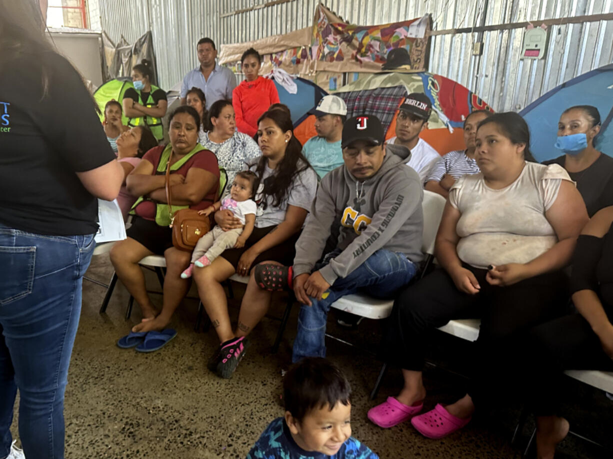 Melissa Shepard, left, directing attorney of Immigrant Defenders Law Center, explains the Biden administration&#039;s new asylum restrictions to migrants at the Juventud 2000 shelter in Tijuana, Mexico, on Monday, June 17, 2024.