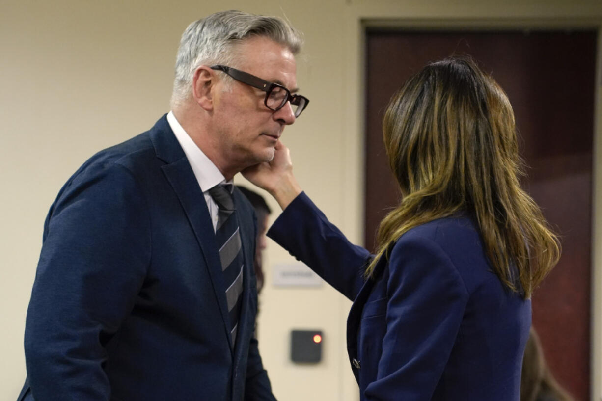 Actor Alec Baldwin approaches his wife Hilaria during his trial, Thursday,  July 11, 2024, in Santa Fe, N.M. Baldwin is charged with involuntary manslaughter in the 2021 fatal shooting of cinematographer Halyna Hutchins during filming of the Western movie &quot;Rust&quot;.