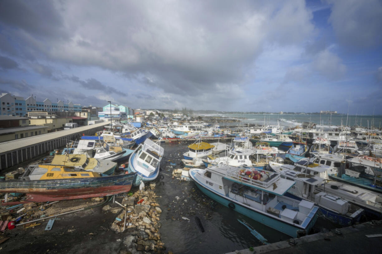 Fishing vessels lie damaged after Hurricane Beryl passed through the Bridgetown Fisheries in Barbados, Monday, July 1, 2024.