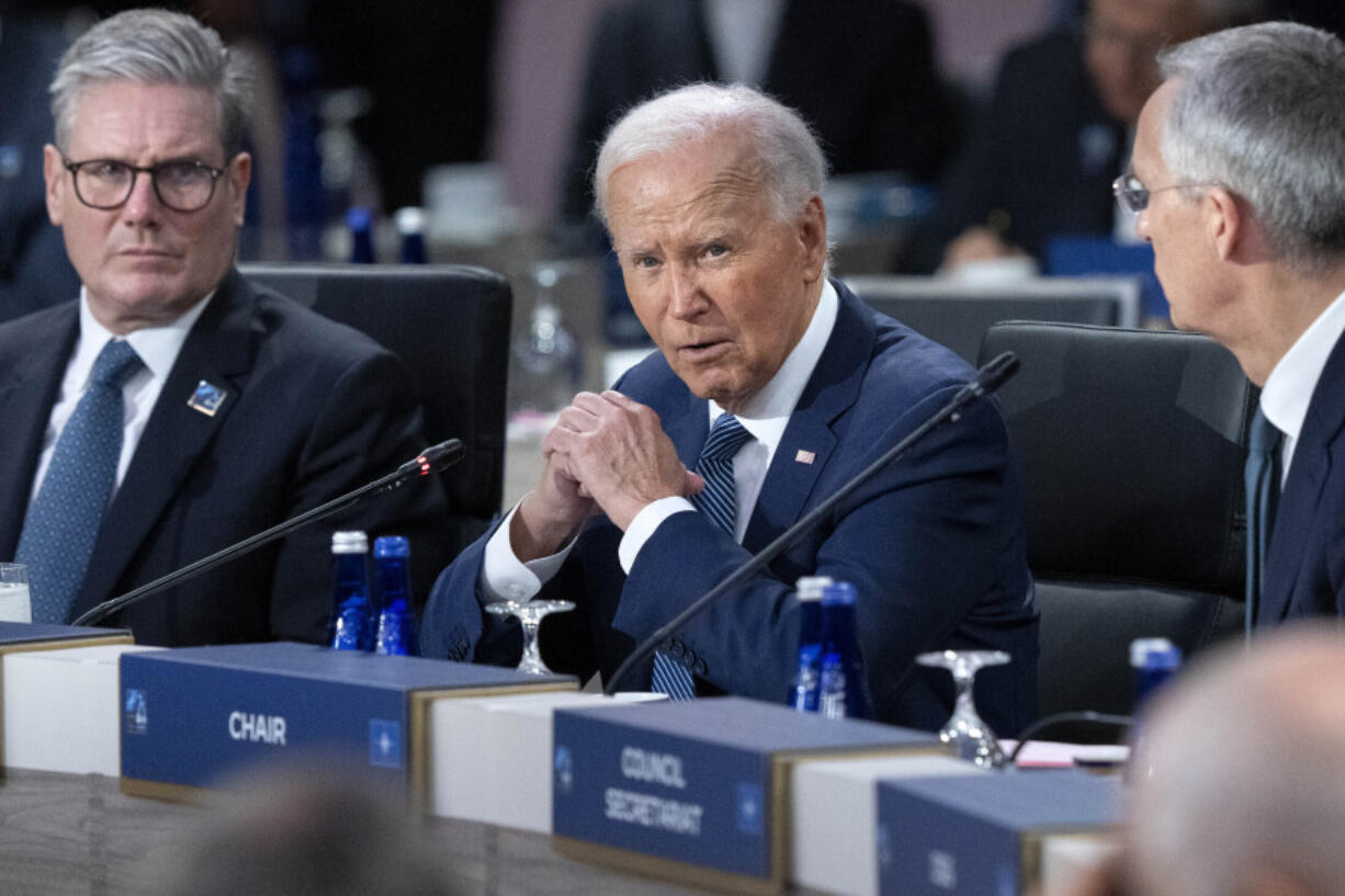 FILE - President Joe Biden, center, makes opening remarks during the NATO summit in Washington, July 10, 2024. It&rsquo;s been two weeks since Biden&rsquo;s debate with Donald Trump and there&rsquo;s rampant gloom in the party about Biden&rsquo;s chances in the fall if he stays in the race. On Thursday, July 11, the 11th lawmaker joined the list of Democrats calling on Biden to end his candidacy. After days of reckoning, many more are known to be harboring that wish.