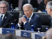 FILE - President Joe Biden, center, makes opening remarks during the NATO summit in Washington, July 10, 2024. It&rsquo;s been two weeks since Biden&rsquo;s debate with Donald Trump and there&rsquo;s rampant gloom in the party about Biden&rsquo;s chances in the fall if he stays in the race. On Thursday, July 11, the 11th lawmaker joined the list of Democrats calling on Biden to end his candidacy. After days of reckoning, many more are known to be harboring that wish.