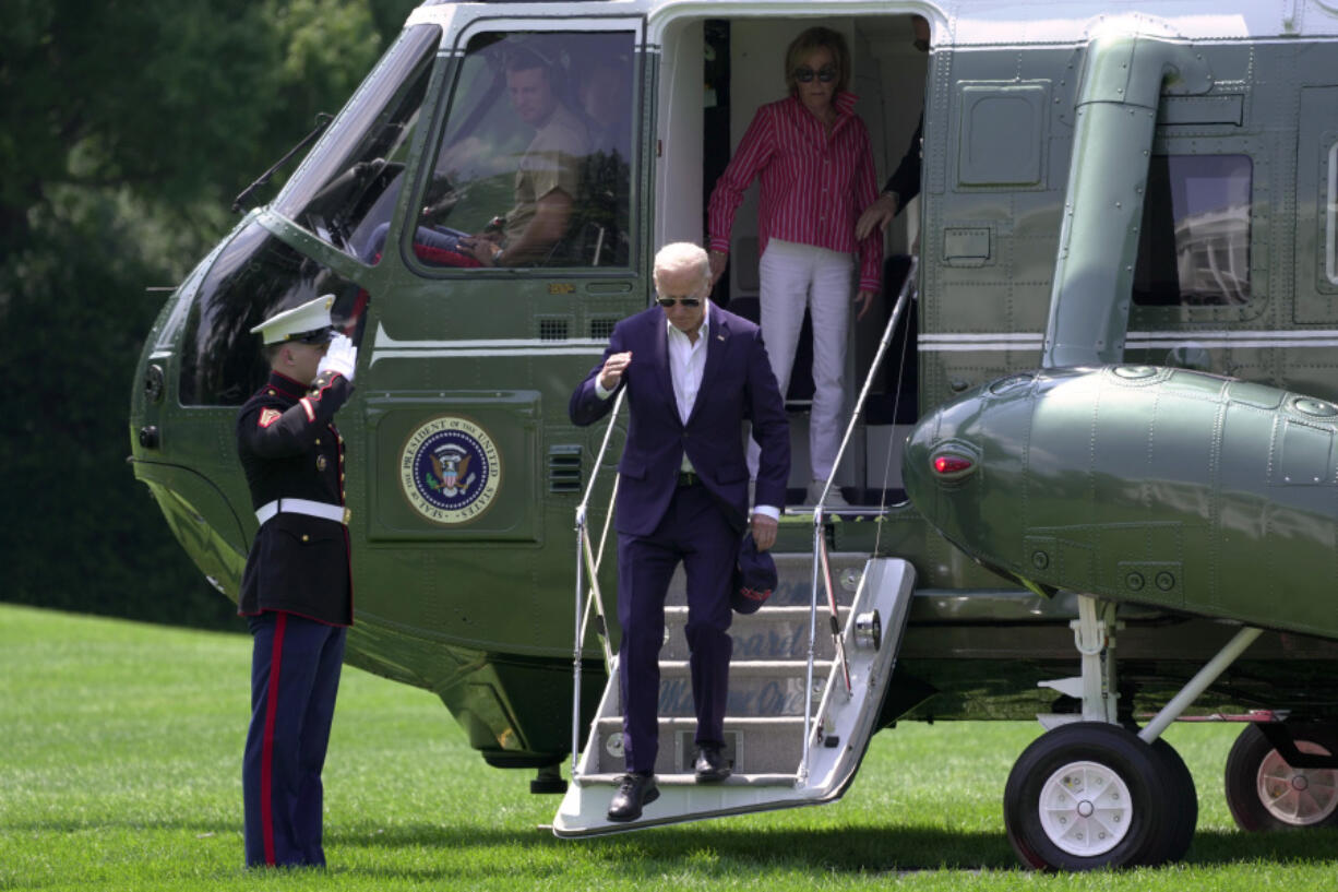 President Joe Biden, left, and his sister Valerie Biden Owens arrive on Marine One at the White House from Camp David, Sunday, July 28, 2024.