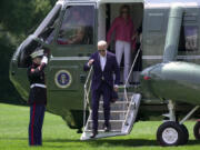 President Joe Biden, left, and his sister Valerie Biden Owens arrive on Marine One at the White House from Camp David, Sunday, July 28, 2024.