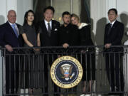 From left, New Zealand&rsquo;s Prime Minister Christopher Luxon, Kim Keon See and her husband South Korea&rsquo;s President Yoon Suk Yeol, Ukraine&rsquo;s President Volodymyr Zelenskyy and his wife Olena Zelenska, and Japan&rsquo;s Prime Minister Fumio Kishida, rwatch from the Blue Room Balcony as President Joe Biden welcome NATO allies and partners to the White House in Washington, Wednesday, July 10, 2024, on the South Lawn for the 75th anniversary of the NATO Summit.