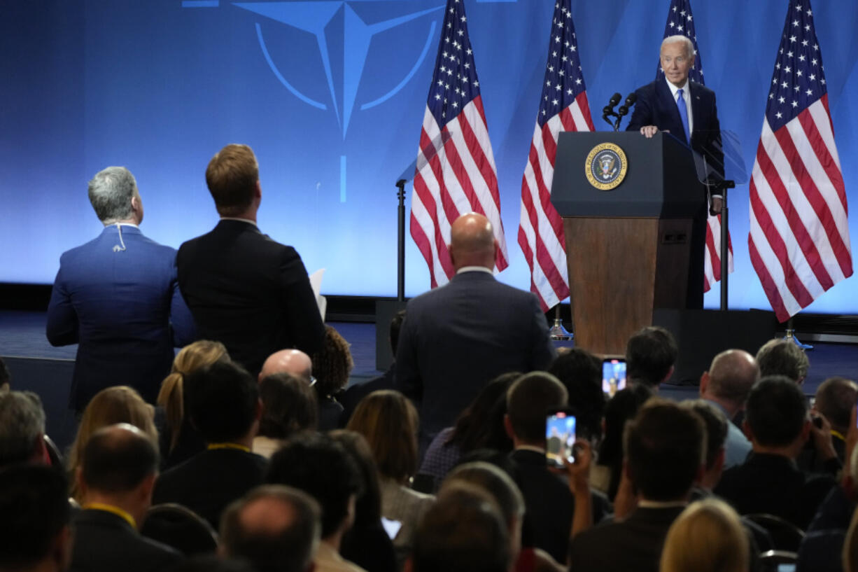 As reporters continue to ask questions, President Joe Biden walks from the podium after a news conference Thursday July 11, 2024, on the final day of the NATO summit in Washington.