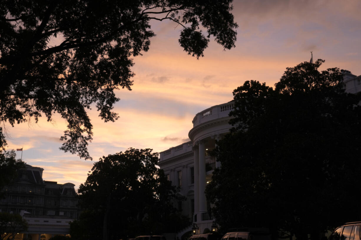 The sun sets over the White House after President Joe Biden speaks at a news conference following the NATO Summit in Washington, Thursday, July 11, 2024.