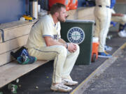 Seattle Mariners outfielder Luke Raley sits in the dugout following a loss to the Toronto Blue Jays in the 10th inning of a baseball game, Sunday, July 7, 2024, in Seattle.