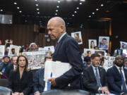 FILE - With protesters in the audience, Boeing CEO Dave Calhoun arrives at a Senate subcommittee hearing to answer to lawmakers about troubles at the aircraft manufacturer. Ike Riffel , a California father whose two sons, died in 2019 when a Boeing 737 Max jetliner crashed in Ethiopia, fears that instead of putting Boeing on trial, the government will offer the company another shot at corporate probation through a legal document called a deferred prosecution agreement, or DPA. (AP Photo/J.