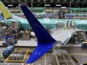 FILE - Boeing 737 MAX airplanes are shown on the assembly line during a media tour at the Boeing facility in Renton, Wash., June 25, 2024.