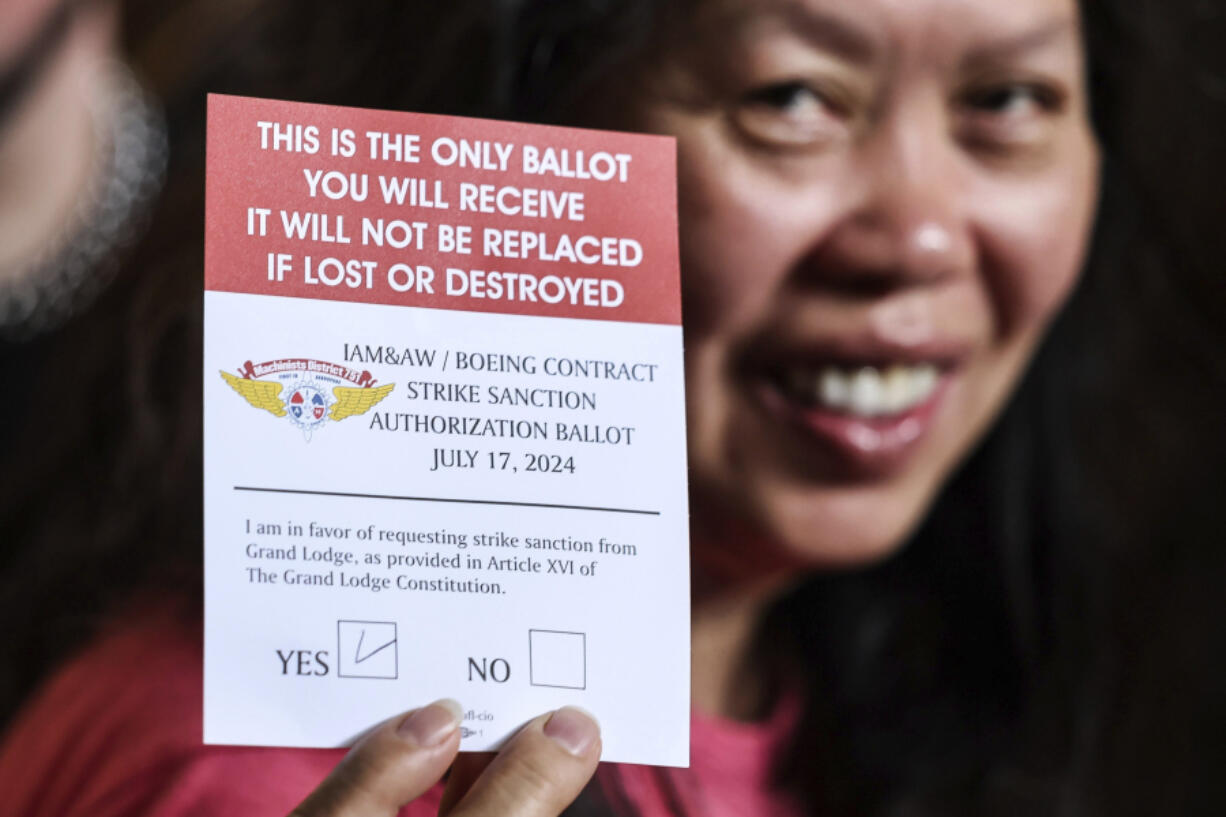 Amy Lay shows off her ballot after the &ldquo;stop work meeting&rdquo; and strike sanction at T-Mobile Park in Seattle, Wednesday, July 17, 2024.