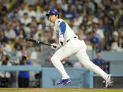 Shohei Ohtani and the Los Angeles Dodgers will open the 2025 MLB season against the Chicago Cubs at Tokyo.  (AP Photo/Mark J.