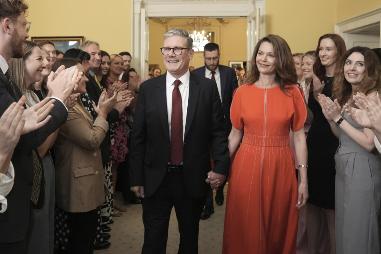 FILE  - Britain&rsquo;s newly elected Prime Minister Keir Starmer and his wife Victoria enter his official London residence at No 10 Downing Street for the first time after the Labour Party won a landslide victory in the 2024 general election, in London, Friday July 5, 2024.  After a few hours of sleep to shake off a night of celebration and an audience with the king, Keir Starmer will step through the front door of 10 Downing St. for the first time as prime minister on Friday.