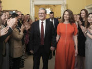 FILE  - Britain&rsquo;s newly elected Prime Minister Keir Starmer and his wife Victoria enter his official London residence at No 10 Downing Street for the first time after the Labour Party won a landslide victory in the 2024 general election, in London, Friday July 5, 2024.  After a few hours of sleep to shake off a night of celebration and an audience with the king, Keir Starmer will step through the front door of 10 Downing St. for the first time as prime minister on Friday.