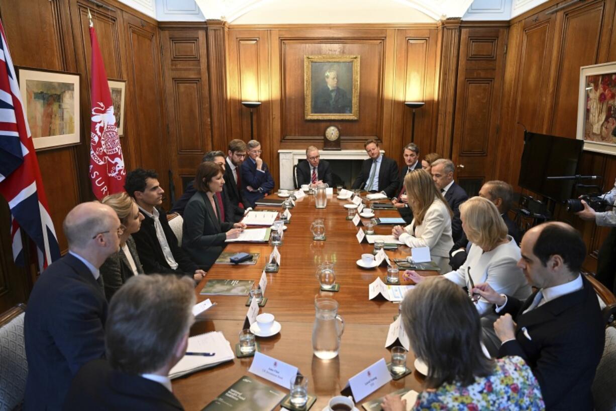 Britain&rsquo;s Chancellor of the Exchequer Rachel Reeves, centre left, chairs a meeting of the National Wealth Fund Taskforce at 11 Downing Street in London, Tuesday, July 9, 2024.