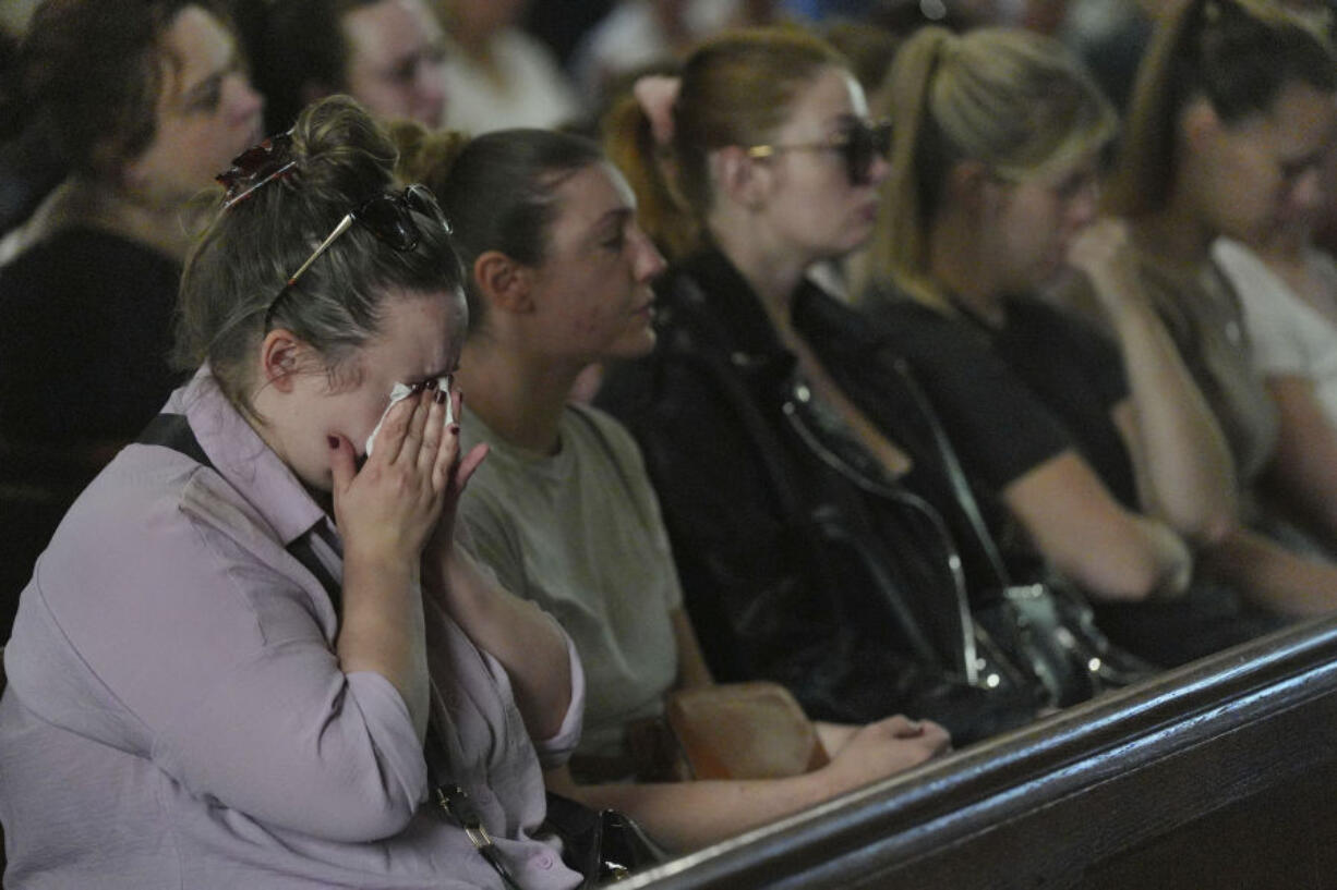 Members of the congregation attend a morning service and vigil at St James&rsquo;s church following the deaths of three women who were killed in an attack at their home, on Tuesday in Bushey, England, Thursday July 11, 2024. A man suspected of killing the wife and daughters of a BBC radio sports commentator with a crossbow is being treated in a hospital after being found injured in a cemetery. Kyle Clifford is suspected of attacking Carol Hunt, 61, and her daughters Hannah, 28 and Louise, 25.
