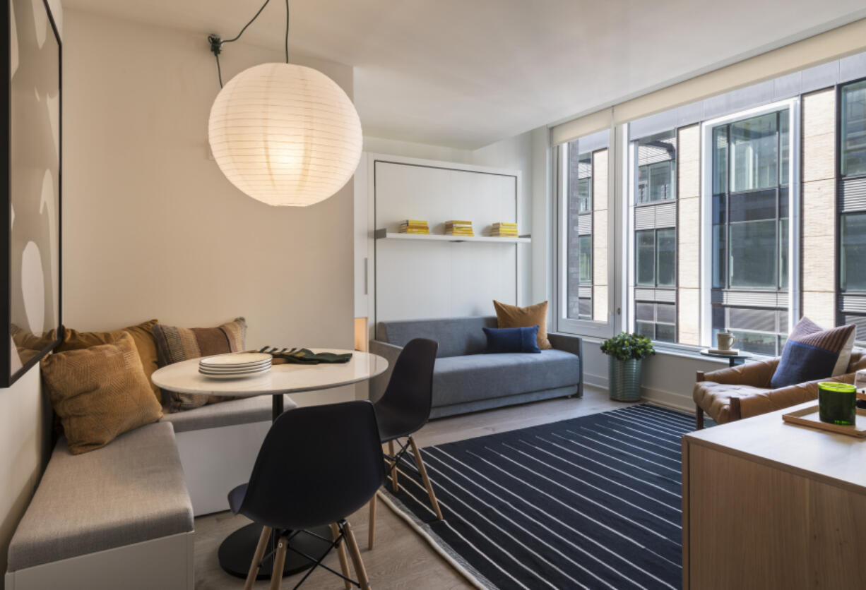 Resource Furniture&rsquo;s Oslo sofa wall bed in a studio apartment designed by JG Neukomm Architecture in The Suffolk building in New York. Fold-down beds are good space savers in small apartments, where it&rsquo;s important to try to define a restful sleep zone.