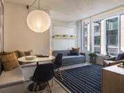 Resource Furniture&rsquo;s Oslo sofa wall bed in a studio apartment designed by JG Neukomm Architecture in The Suffolk building in New York. Fold-down beds are good space savers in small apartments, where it&rsquo;s important to try to define a restful sleep zone.