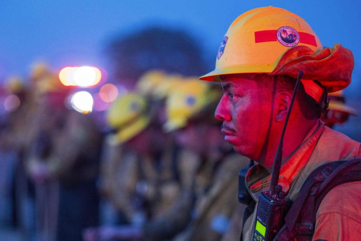 Fire crews monitor a burn operation along Highway 36 to slow the Park Fire near Dales, Calif., Monday, July 29, 2024.