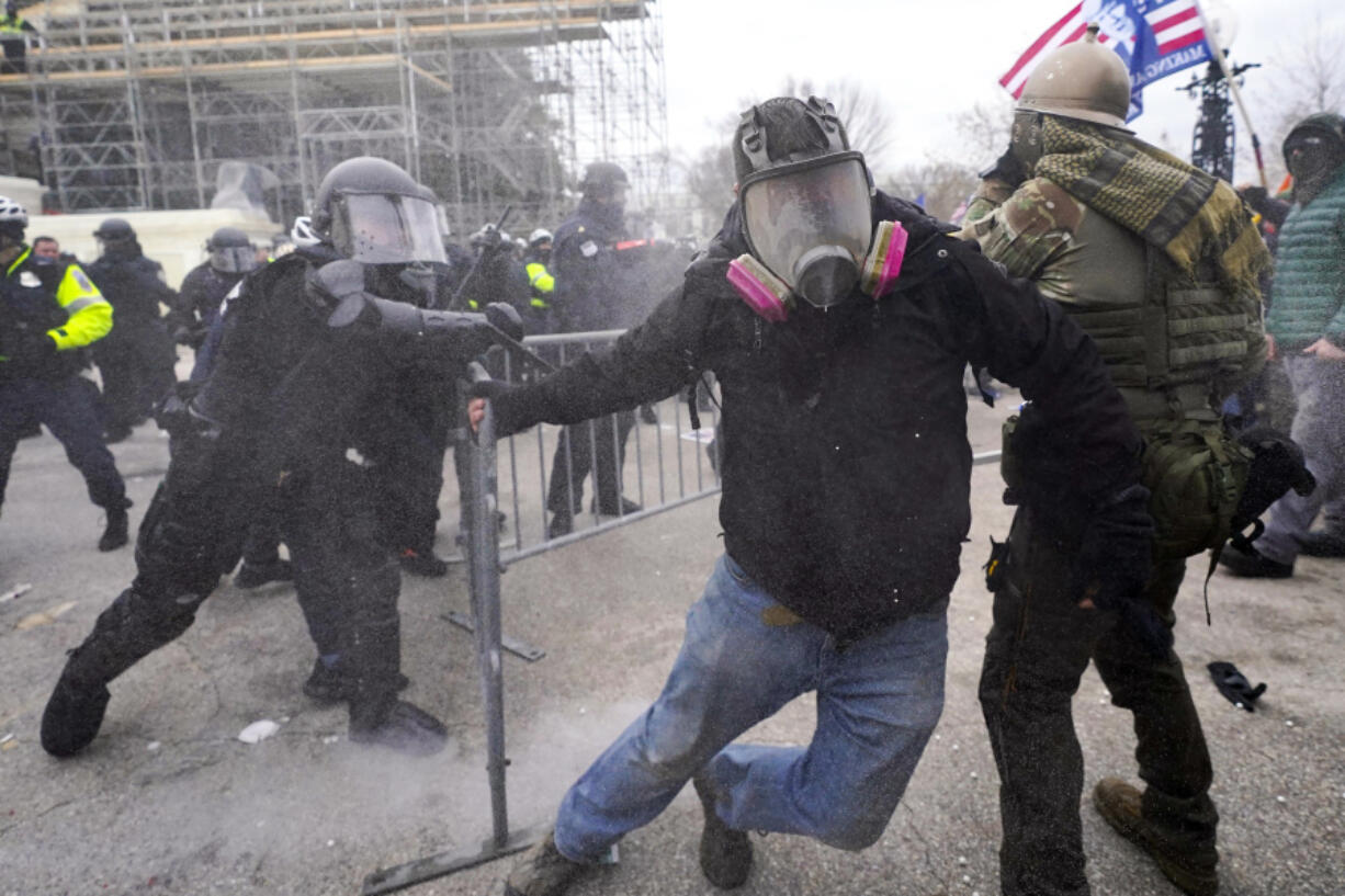 FILE - Insurrectionists loyal to President Donald Trump confront police as they storm the U.S. Capitol on Jan. 6, 2021, in Washington. Former President Donald Trump said during a debate with President Joe Biden last week that the Jan.