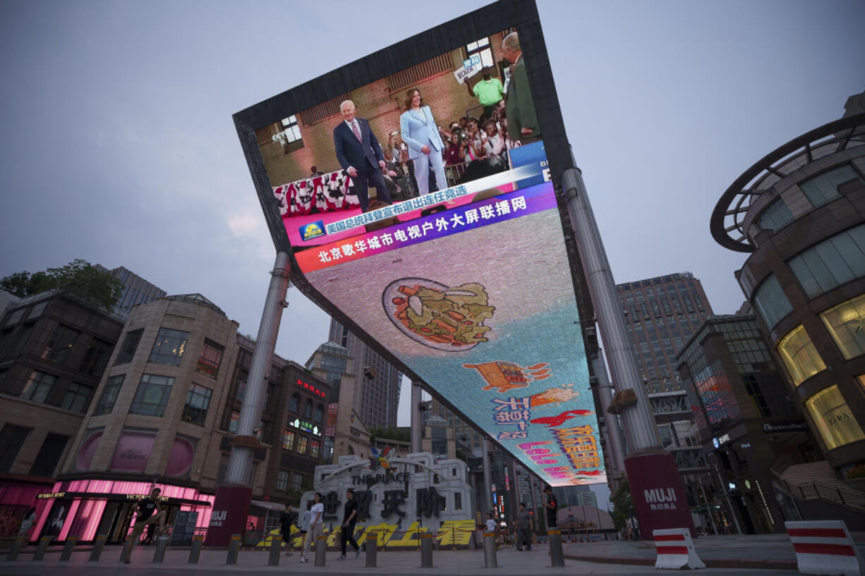 A large screen broadcasts news of U.S. President Joe Biden dropped out the presidential race, at a shopping mall in Beijing, China, Monday, Monday, July 22, 2024. Biden&rsquo;s withdrawal from the U.S. presidential race injects greater uncertainty into the world at a time when Western leaders are grappling with wars in Ukraine and Gaza, a more assertive China in Asia and the rise of the far-right in Europe.