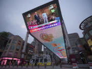 A large screen broadcasts news of U.S. President Joe Biden dropped out the presidential race, at a shopping mall in Beijing, China, Monday, Monday, July 22, 2024. Biden&rsquo;s withdrawal from the U.S. presidential race injects greater uncertainty into the world at a time when Western leaders are grappling with wars in Ukraine and Gaza, a more assertive China in Asia and the rise of the far-right in Europe.